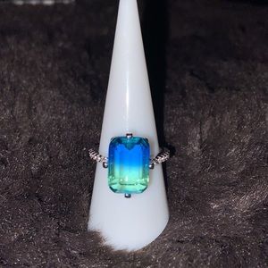 Silver ring with a aurora borealis stone and  climbing crystals on the sides